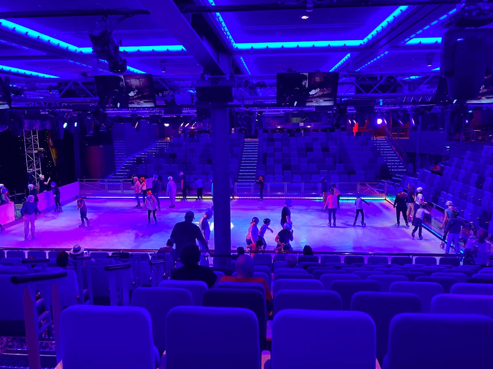 a group of people on ice in a theater