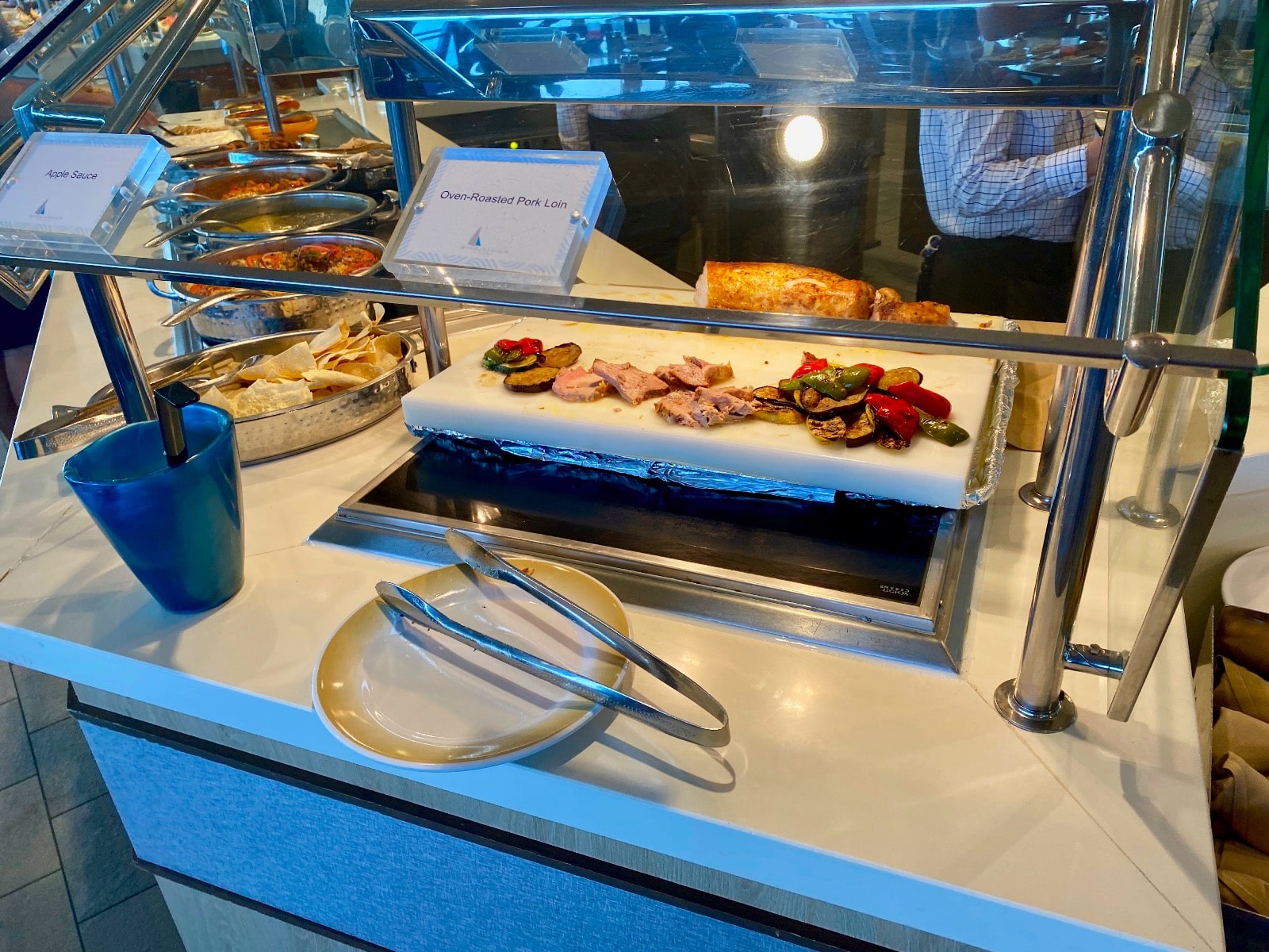 food on a counter with a plate and utensils