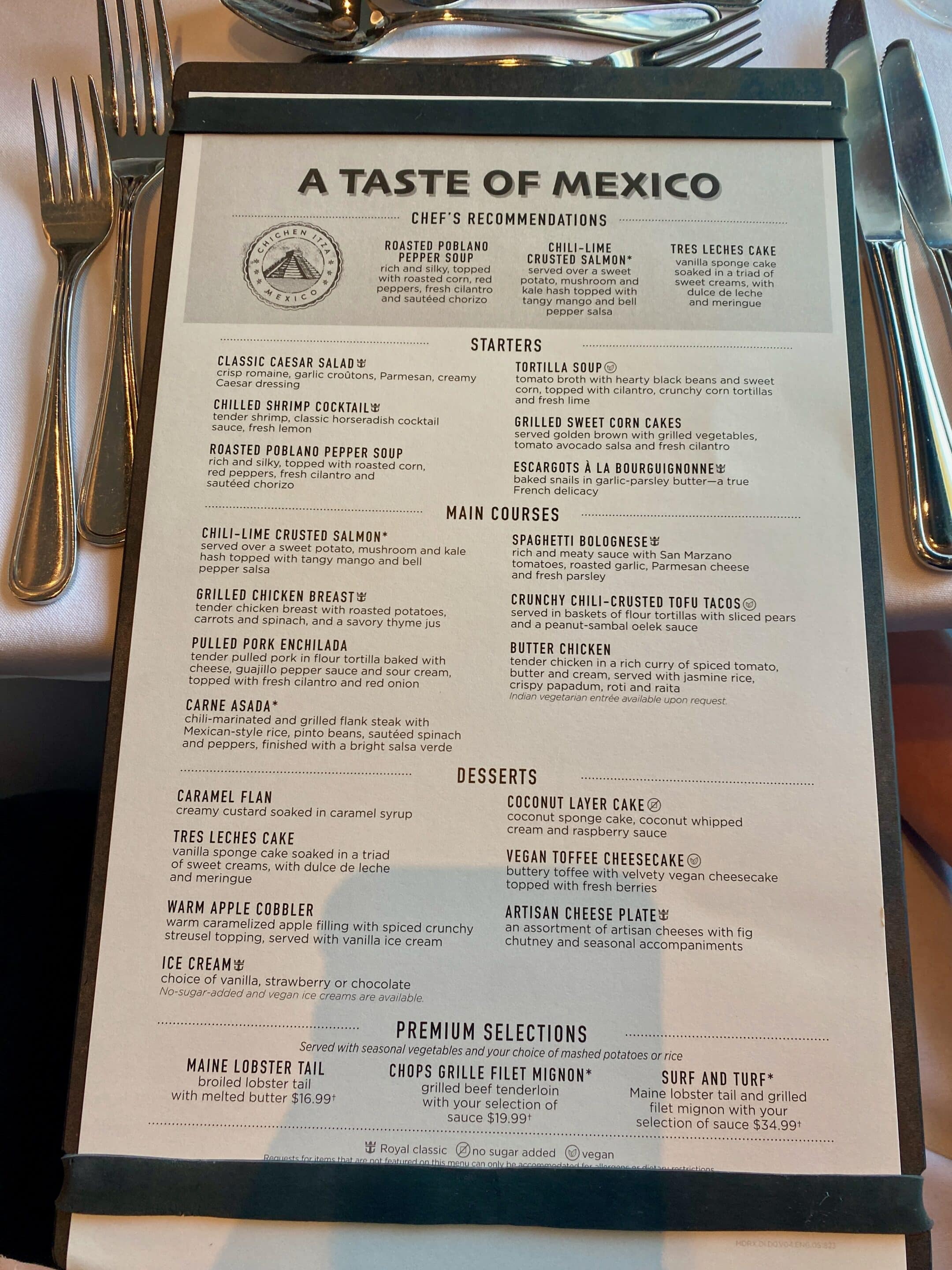 a menu with silverware on a table