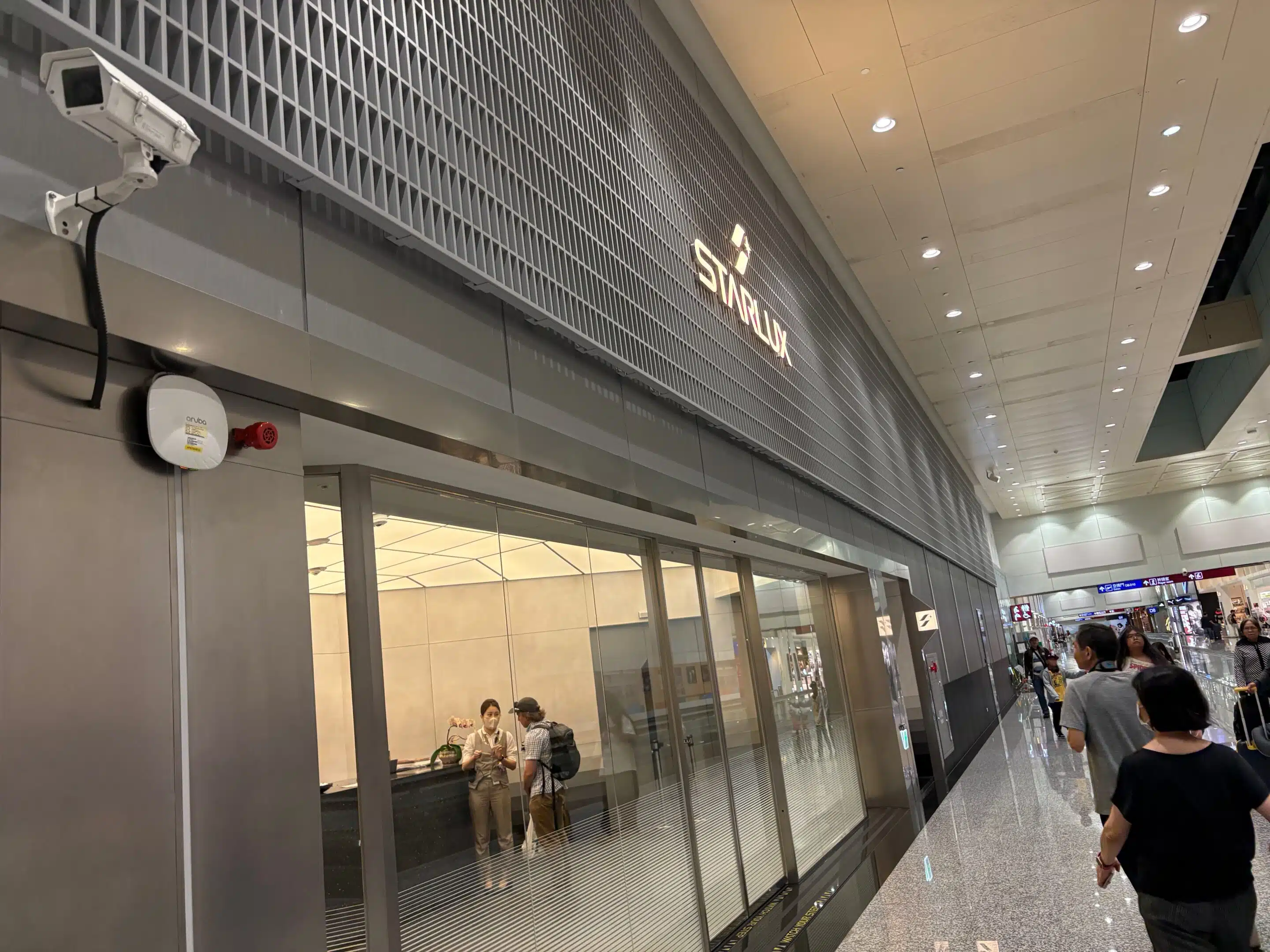 a group of people walking in a building