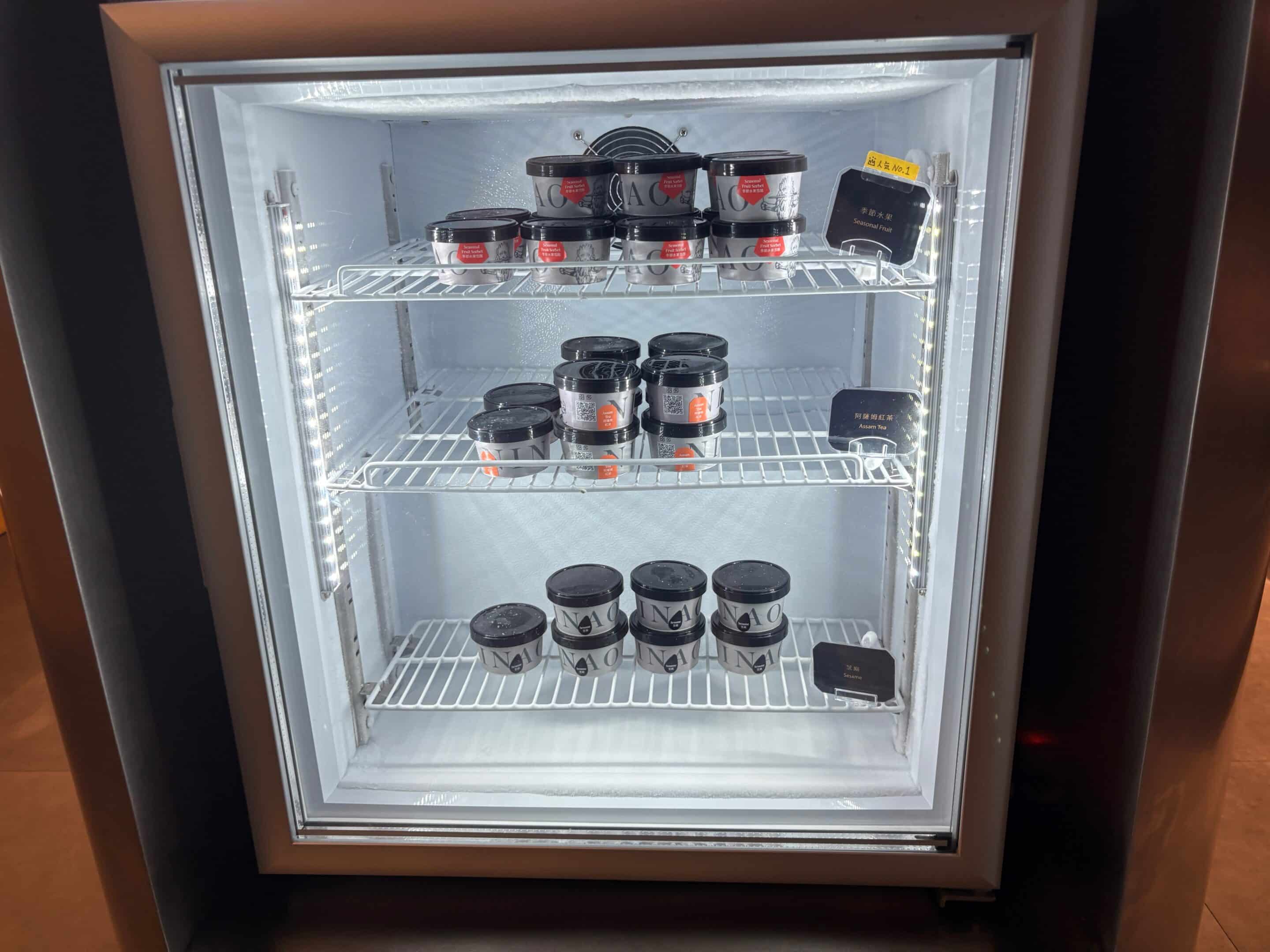 a refrigerator with jars of food on shelves