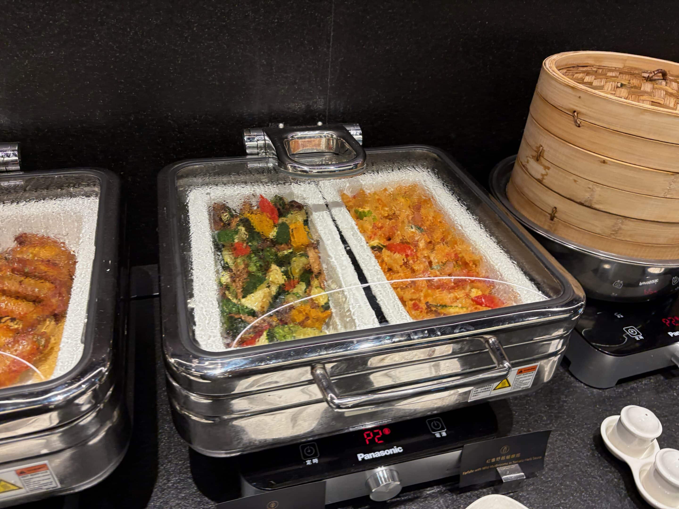 food in a steamer on a counter