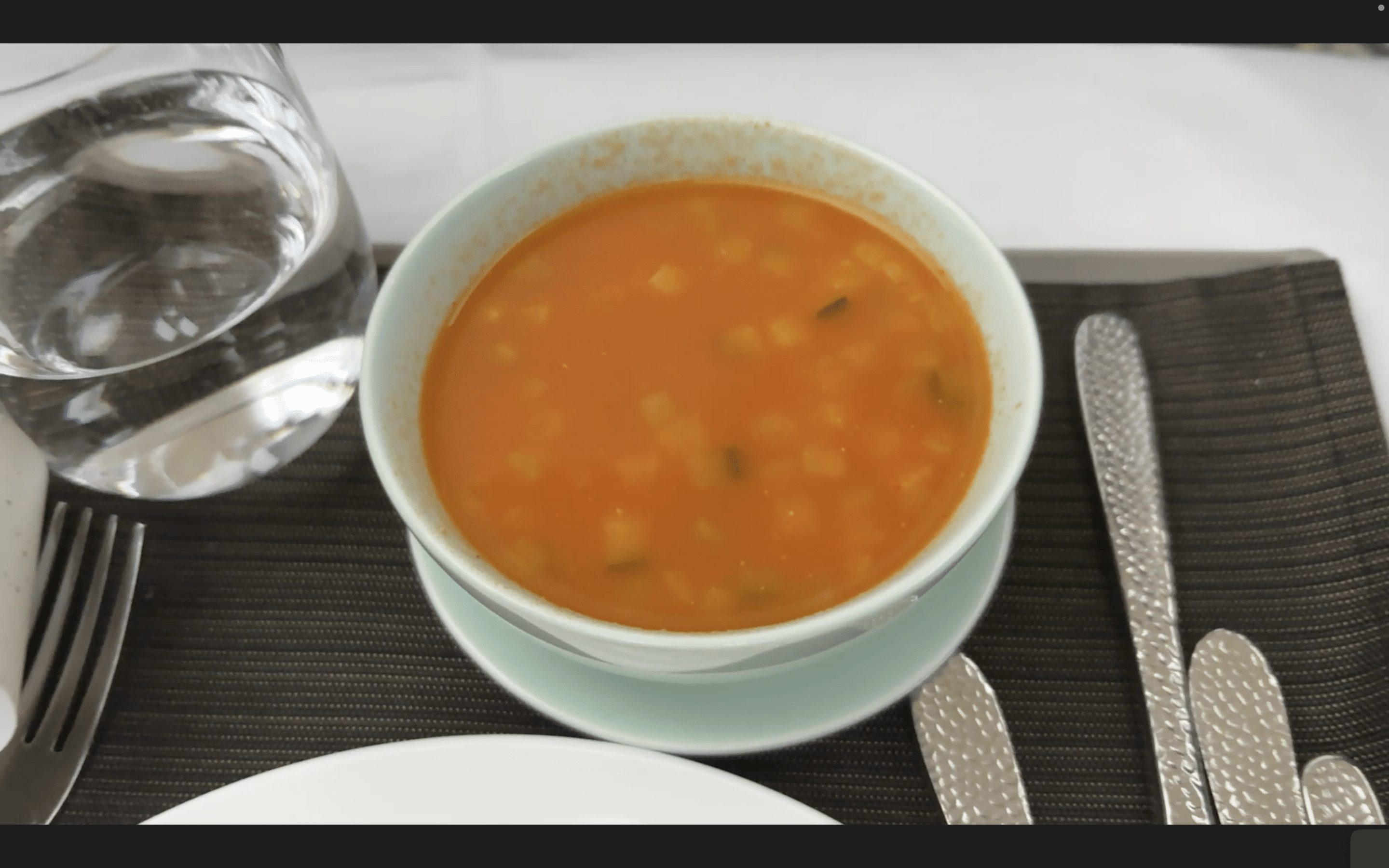 a bowl of soup on a saucer