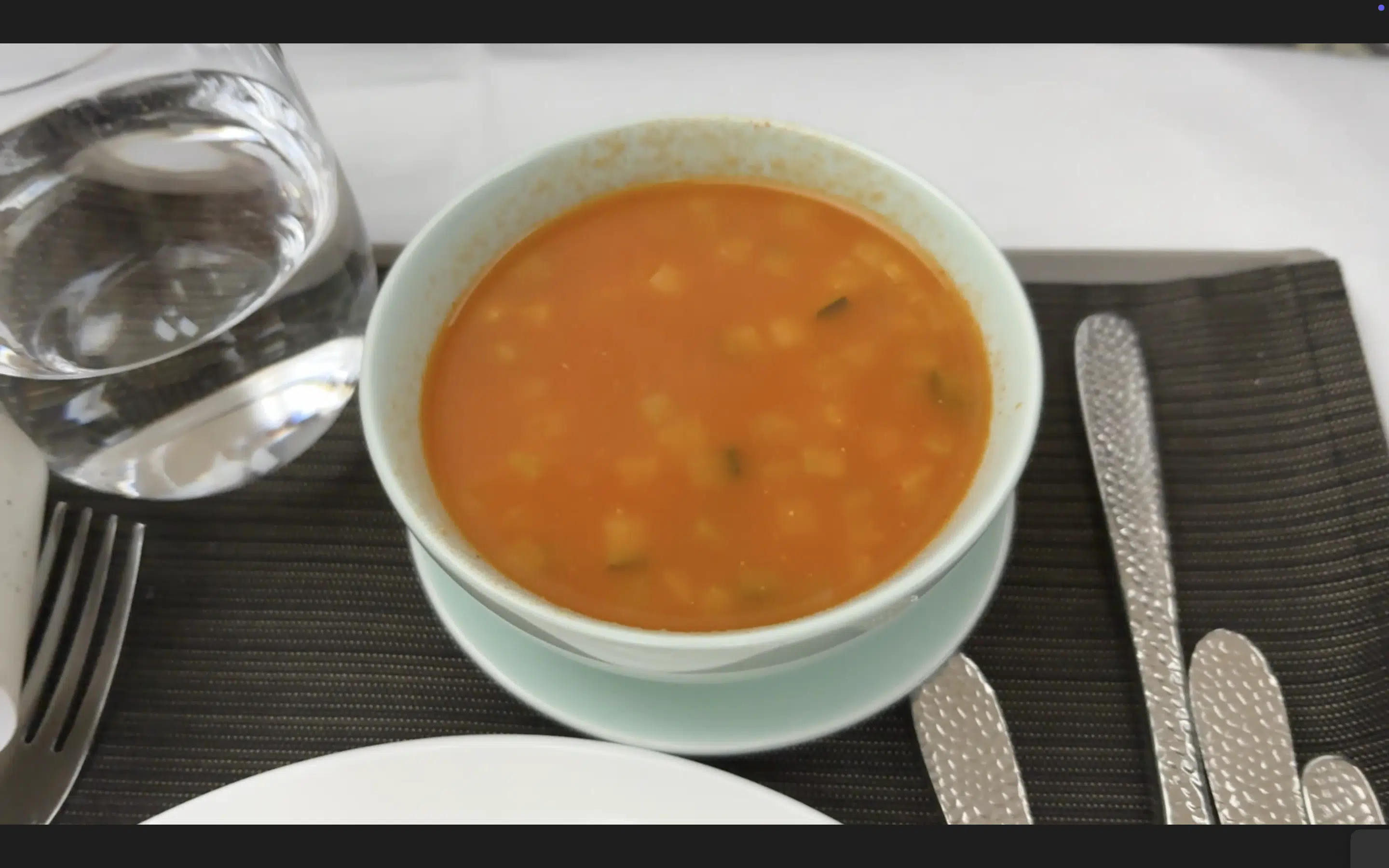 a bowl of soup on a saucer