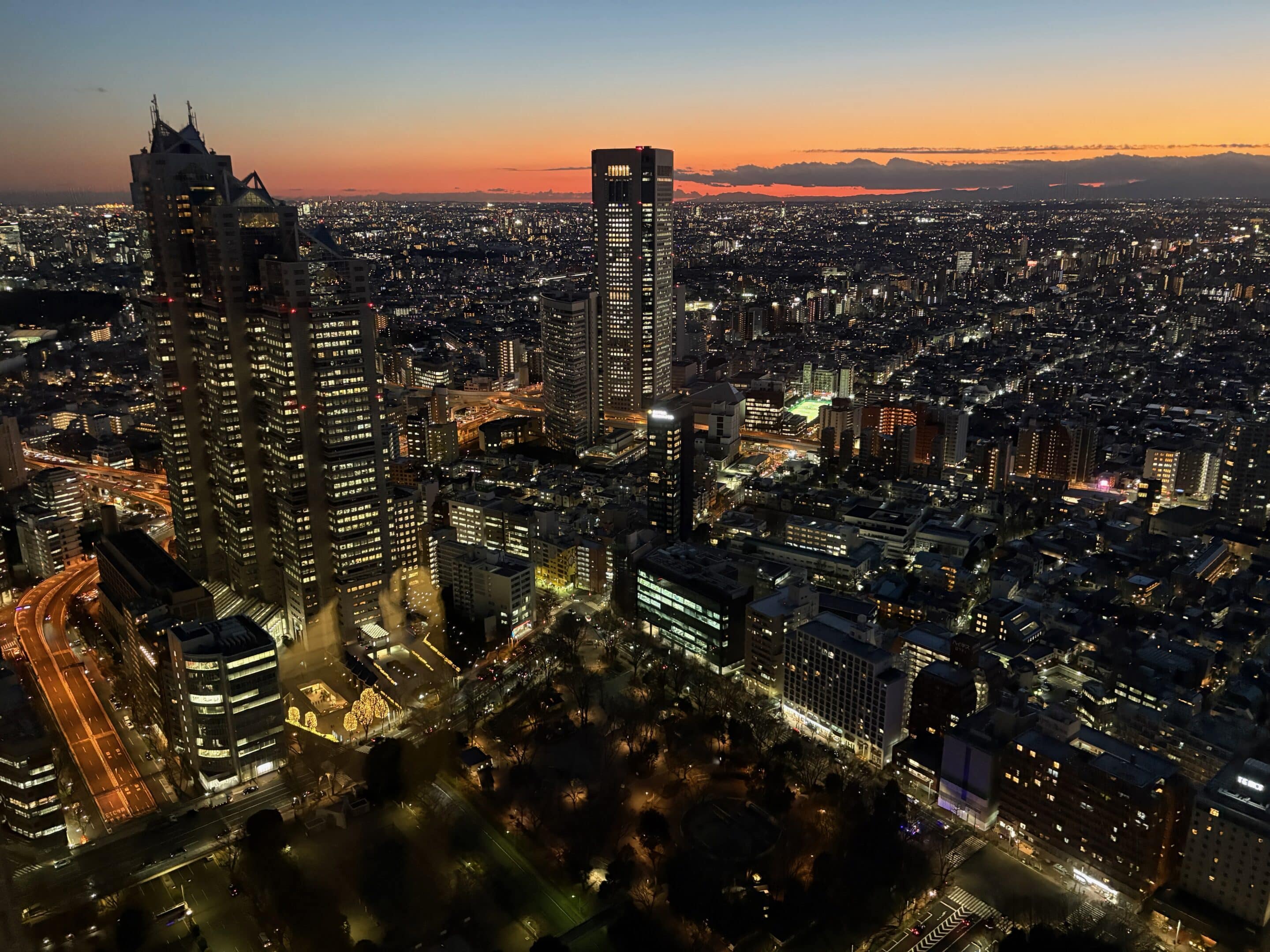 a city with many tall buildings at night