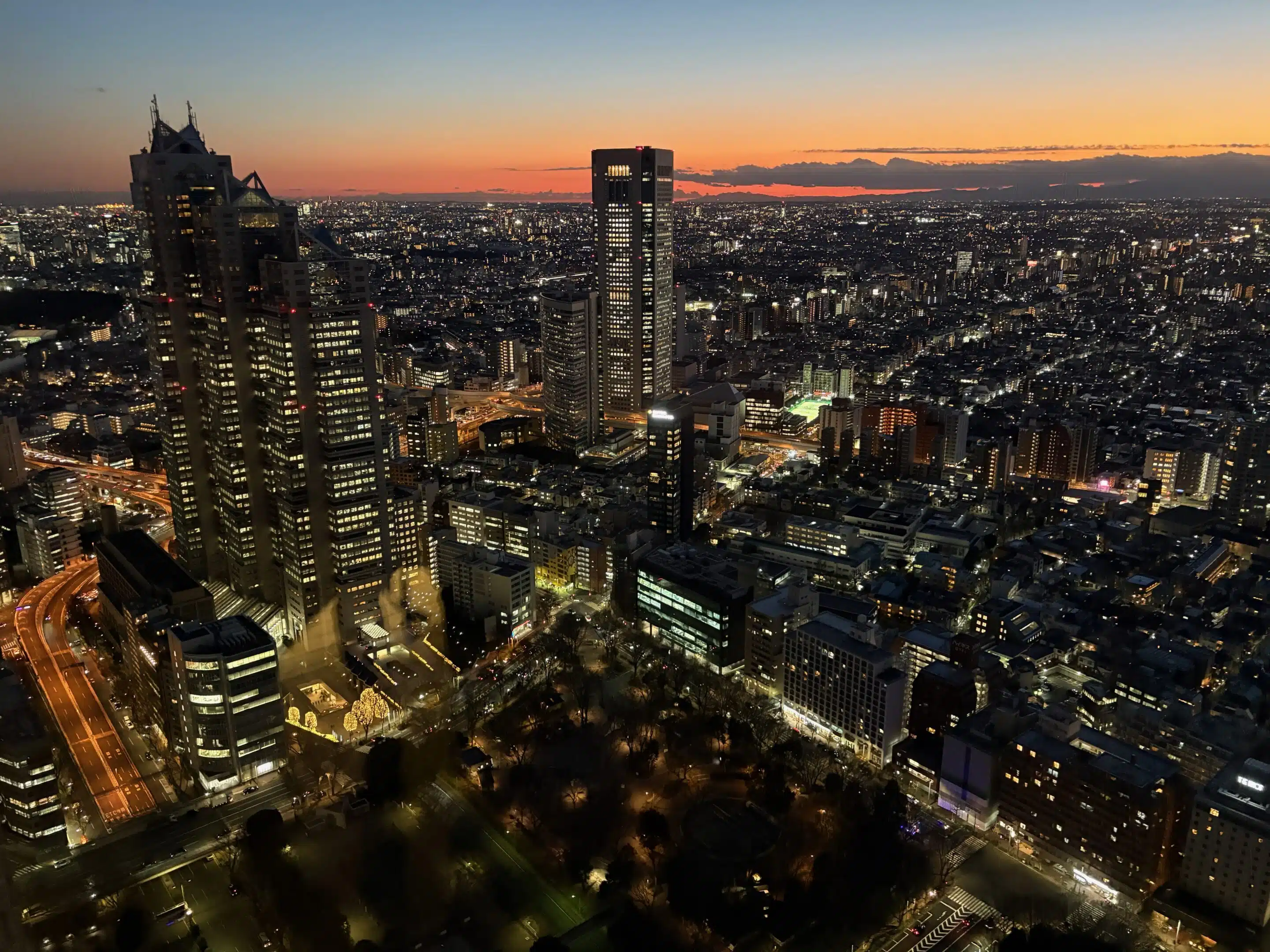 a city with many tall buildings at night
